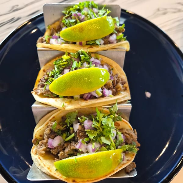 Street tacos with lime, cilantro, and onion